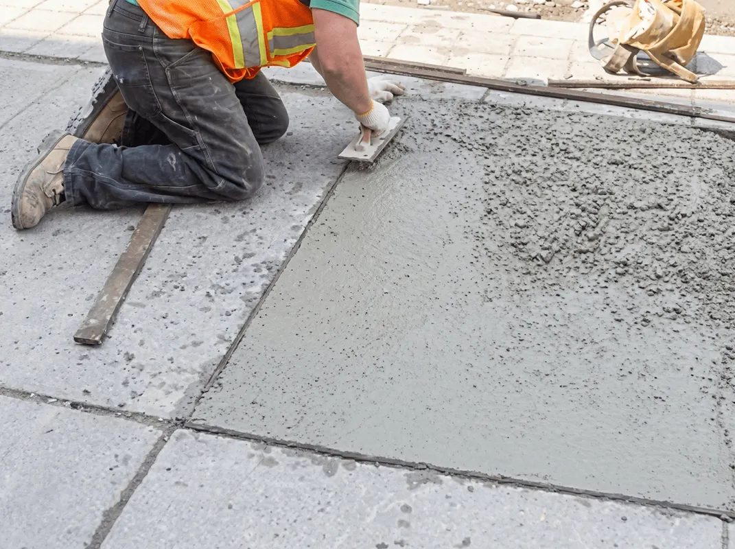 Professional repairing a concrete floor in Madison, WI